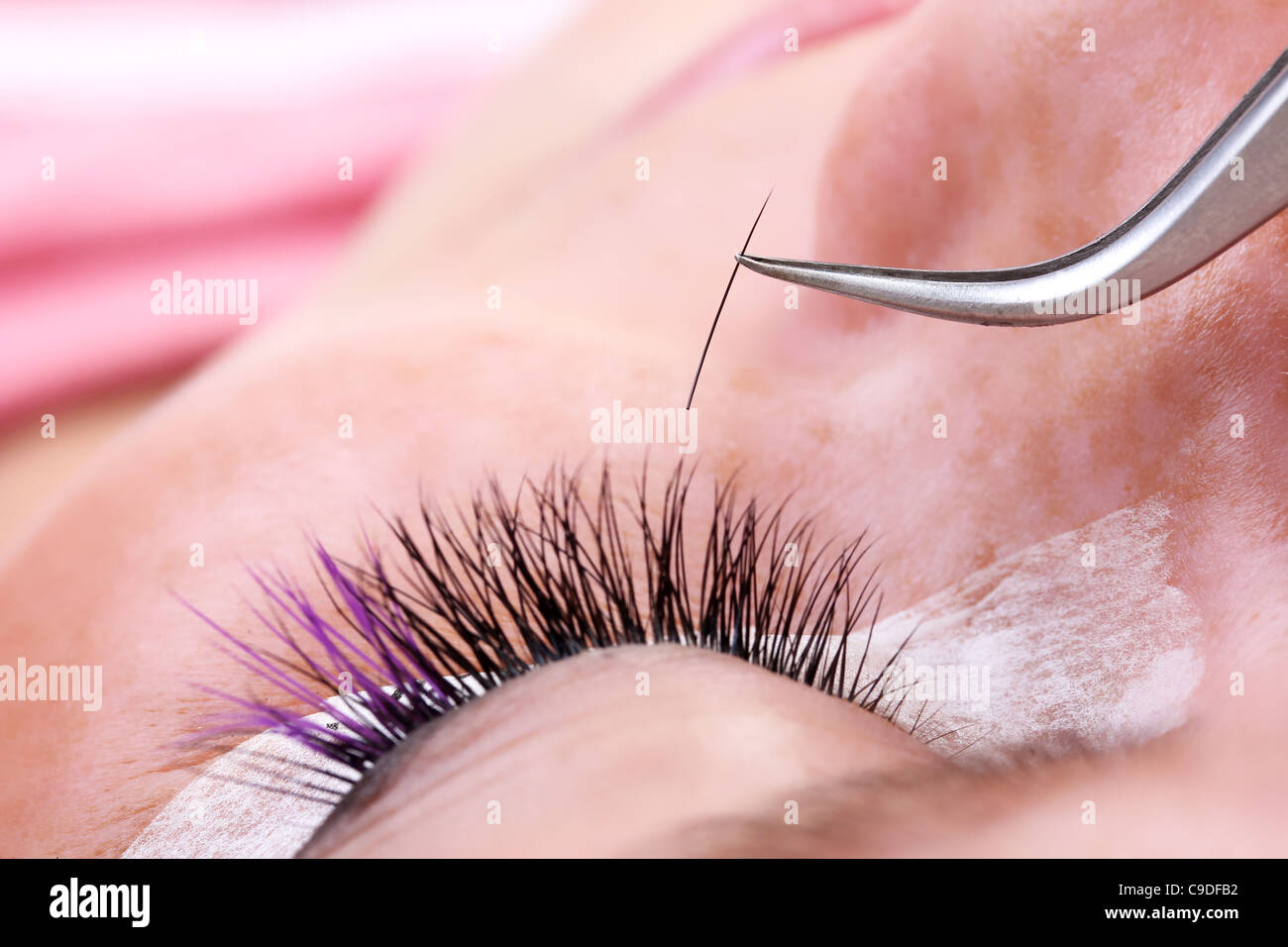 Lash making process, extreme long lashes and tweezers, close-up Stock Photo