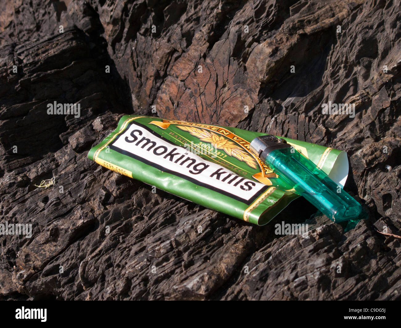 Llangrannog Llandysul Dyfed Roll ups cigarette paraphenalia left on beach Stock Photo