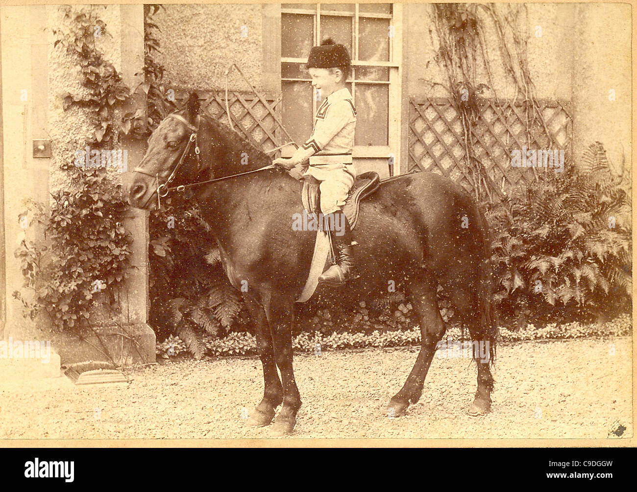 Cabinet photograph of boy on pony Stock Photo