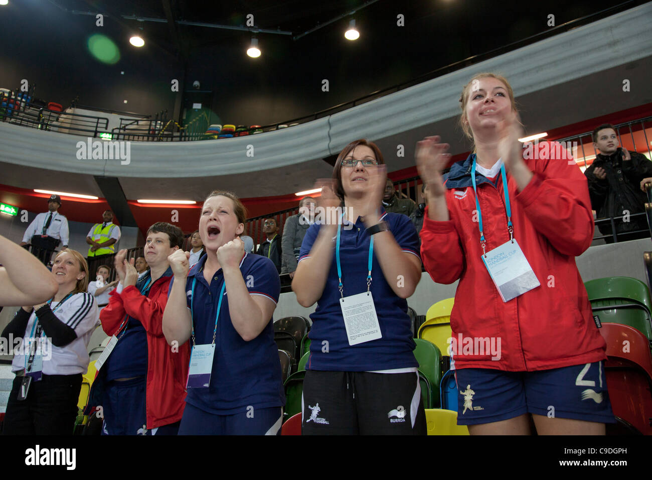 Women watch handball competition during preparation for the London 2012 Olympics, UK Stock Photo