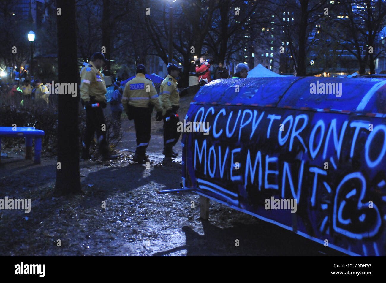 November 23, 2011, Toronto Police deploy in significant numbers this morning, beginning the process of evicting the Occupy Toronto tent camp from St. James Park. Stock Photo