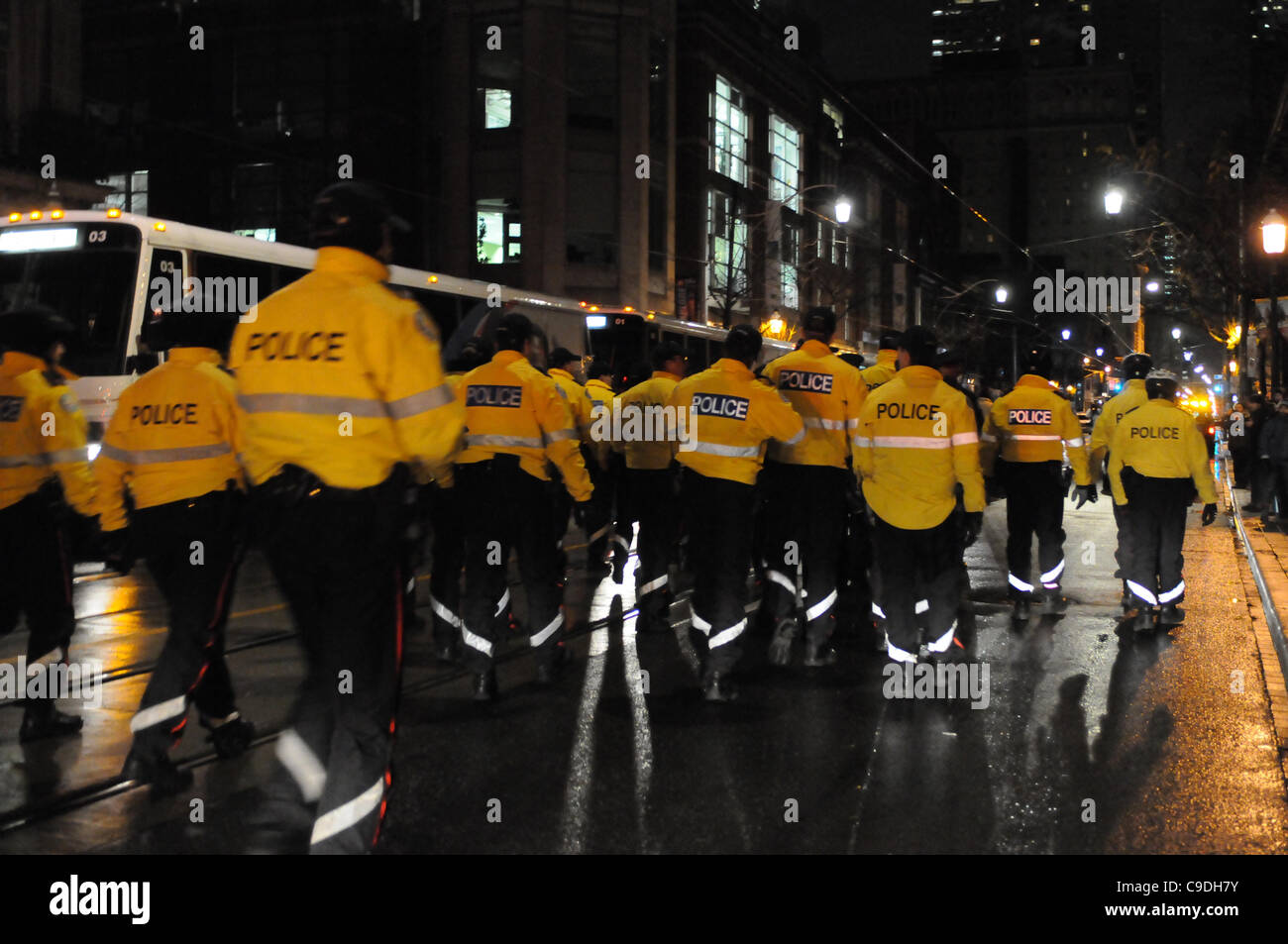 November 23, 2011, Toronto Police deploy in significant numbers during the hour before dawn this morning, beginning the process of evicting the Occupy Toronto tent camp from St. James Park. Stock Photo