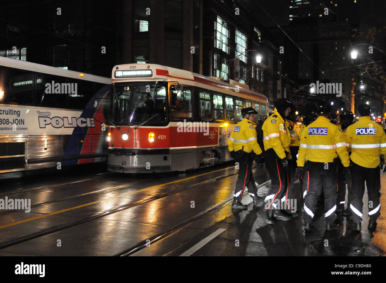 November 23, 2011, Toronto Police deploy in significant numbers during the hour before dawn this morning, beginning the process of evicting the Occupy Toronto tent camp from St. James Park. Stock Photo