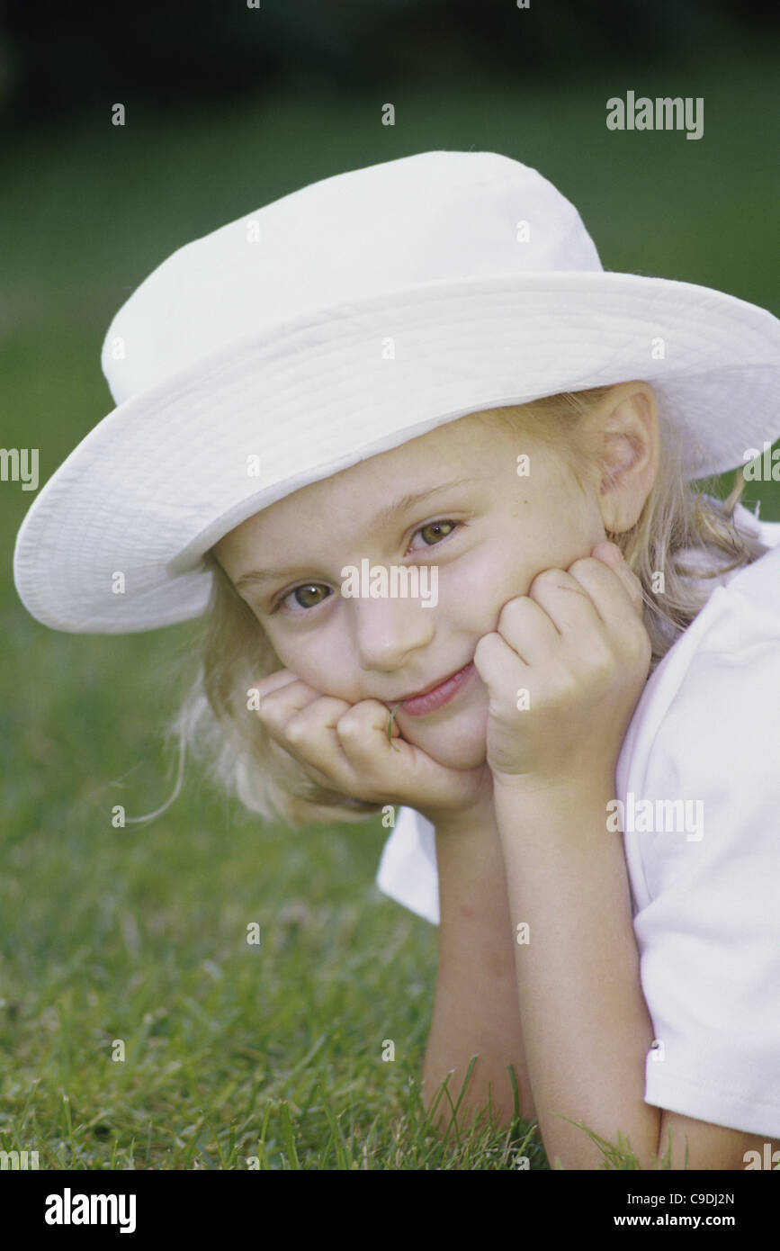 Portrait of a girl on a lawn Stock Photo - Alamy