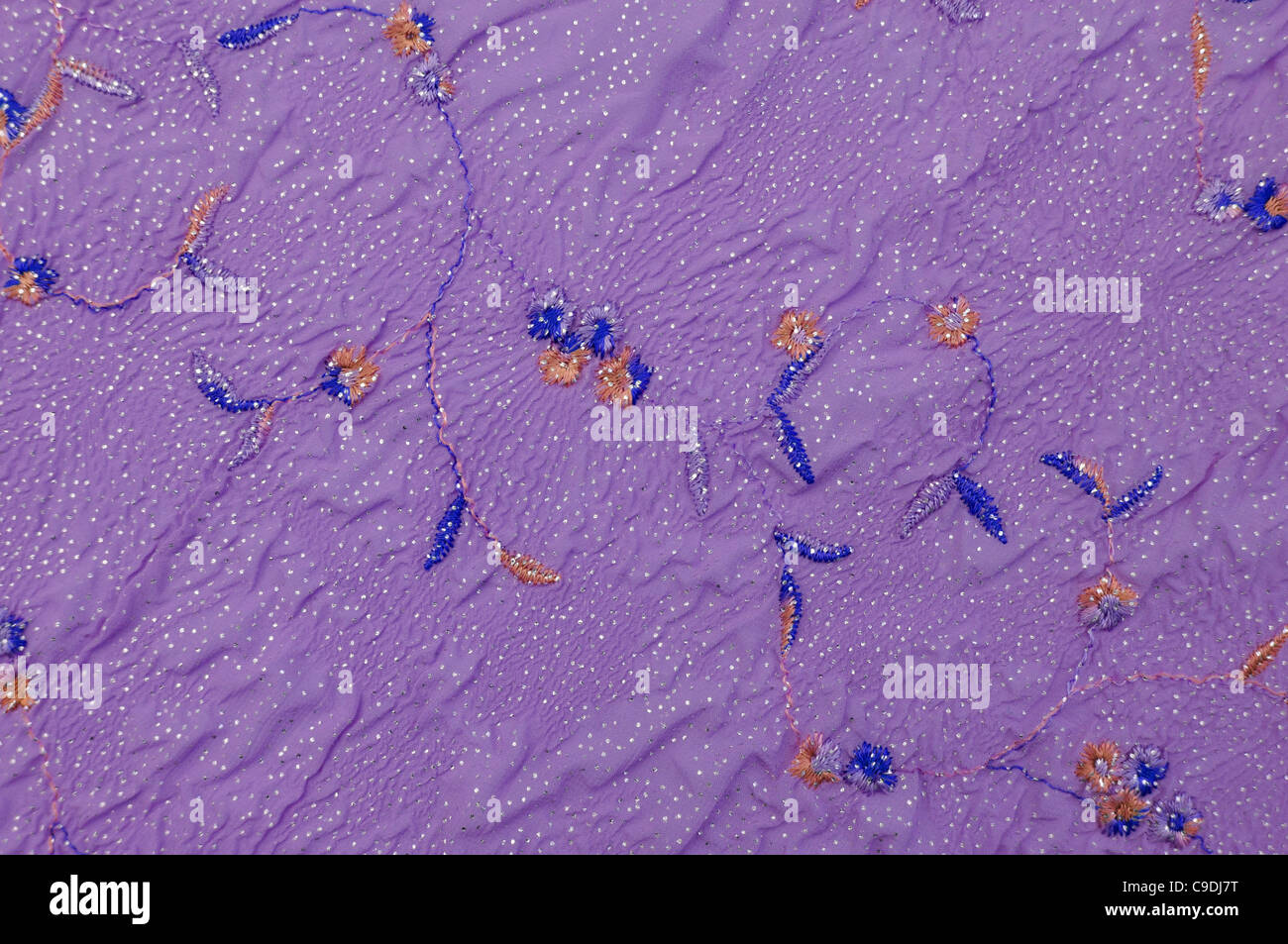 Purple swatch of vintage crumple cloth with embroidery Stock Photo - Alamy