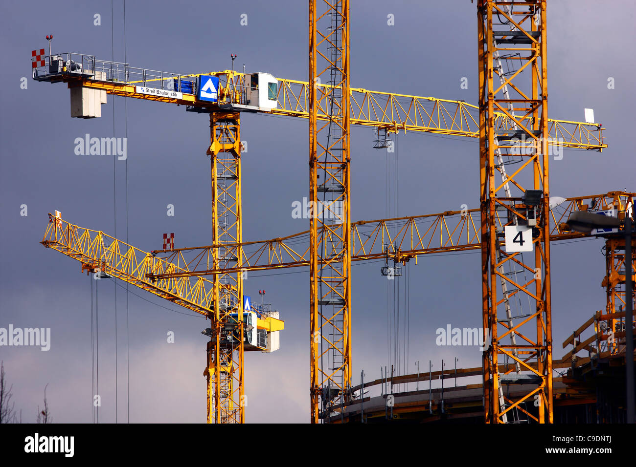 Construction site of a new administration building. Construction cranes. Innenhafen, Duisburg, Germany. Stock Photo