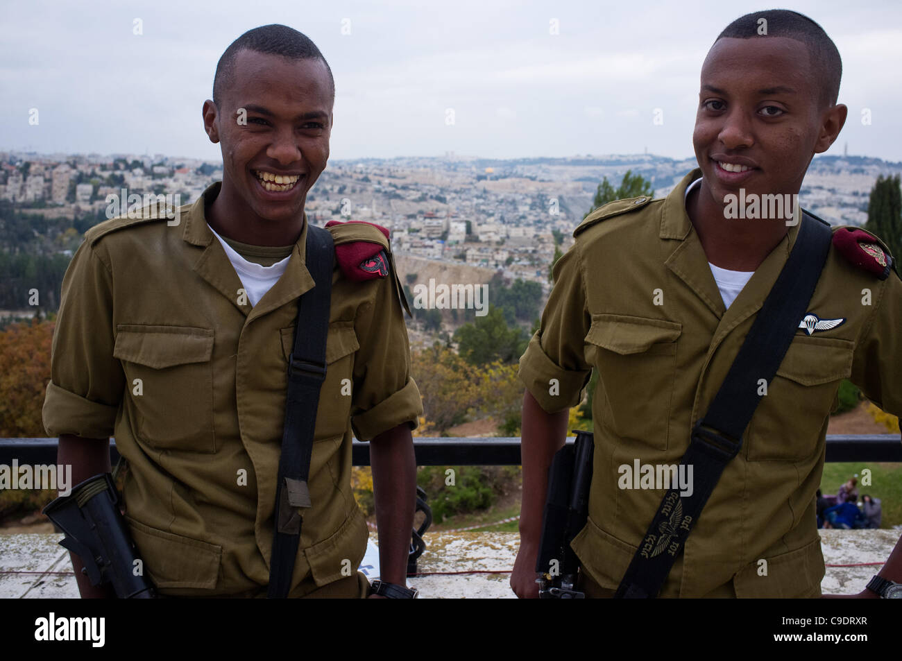 Two Ethiopian IDF soldiers of the Paratroopers Brigade pose for a photo at the Sigd Holiday celebrations, symbolizing their yearning for Jerusalem, at the Sherover Promenade overlooking the Temple Mount. Jerusalem, Israel. 24th November 2011. Stock Photo