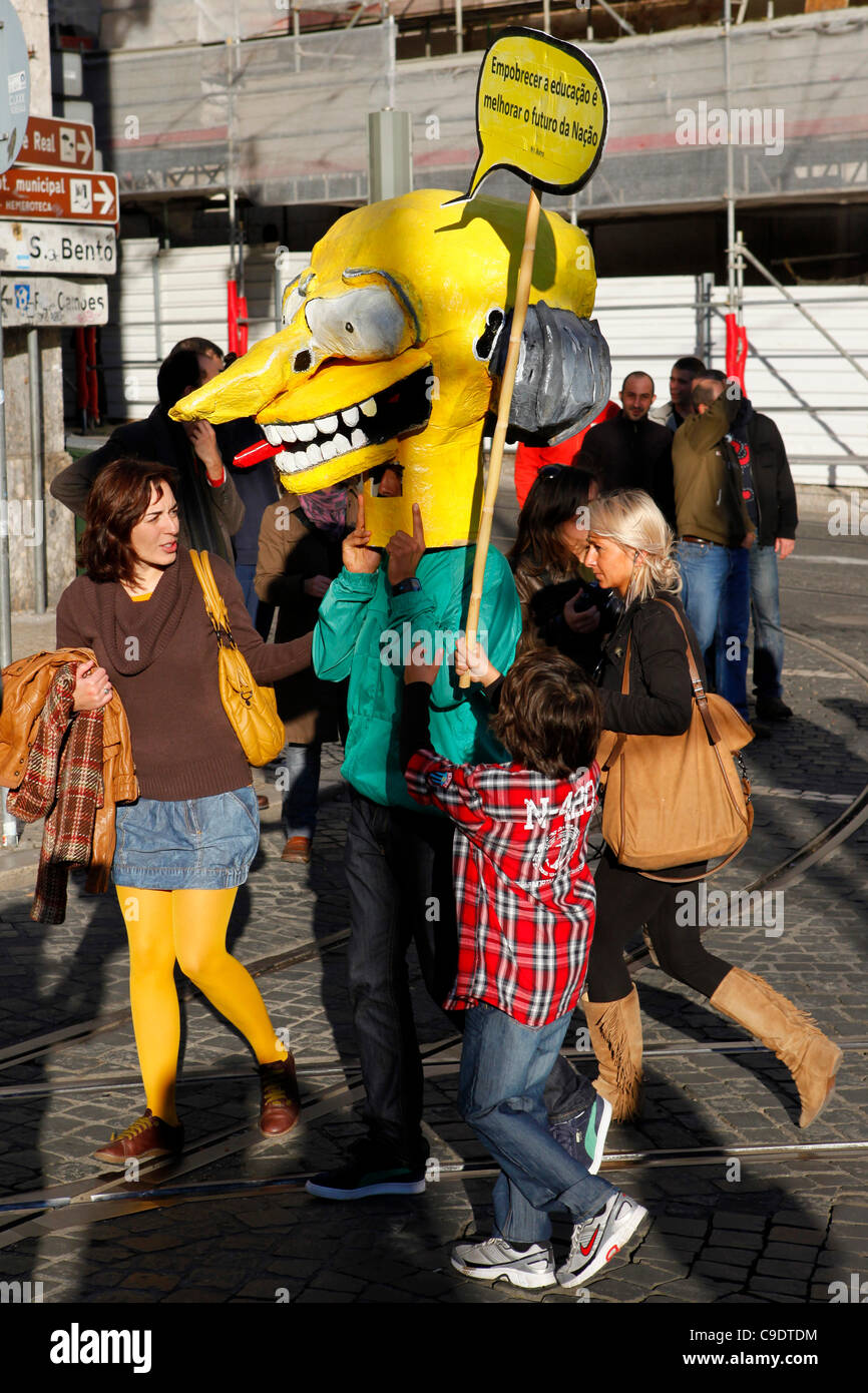 A person dressed as The Simpsons character Montgomery Burns joins workers and union members taking part in the 24-hour Portuguese General Strike and demonstrate against the government's austerity programme in Lisbon, Portugal. Stock Photo