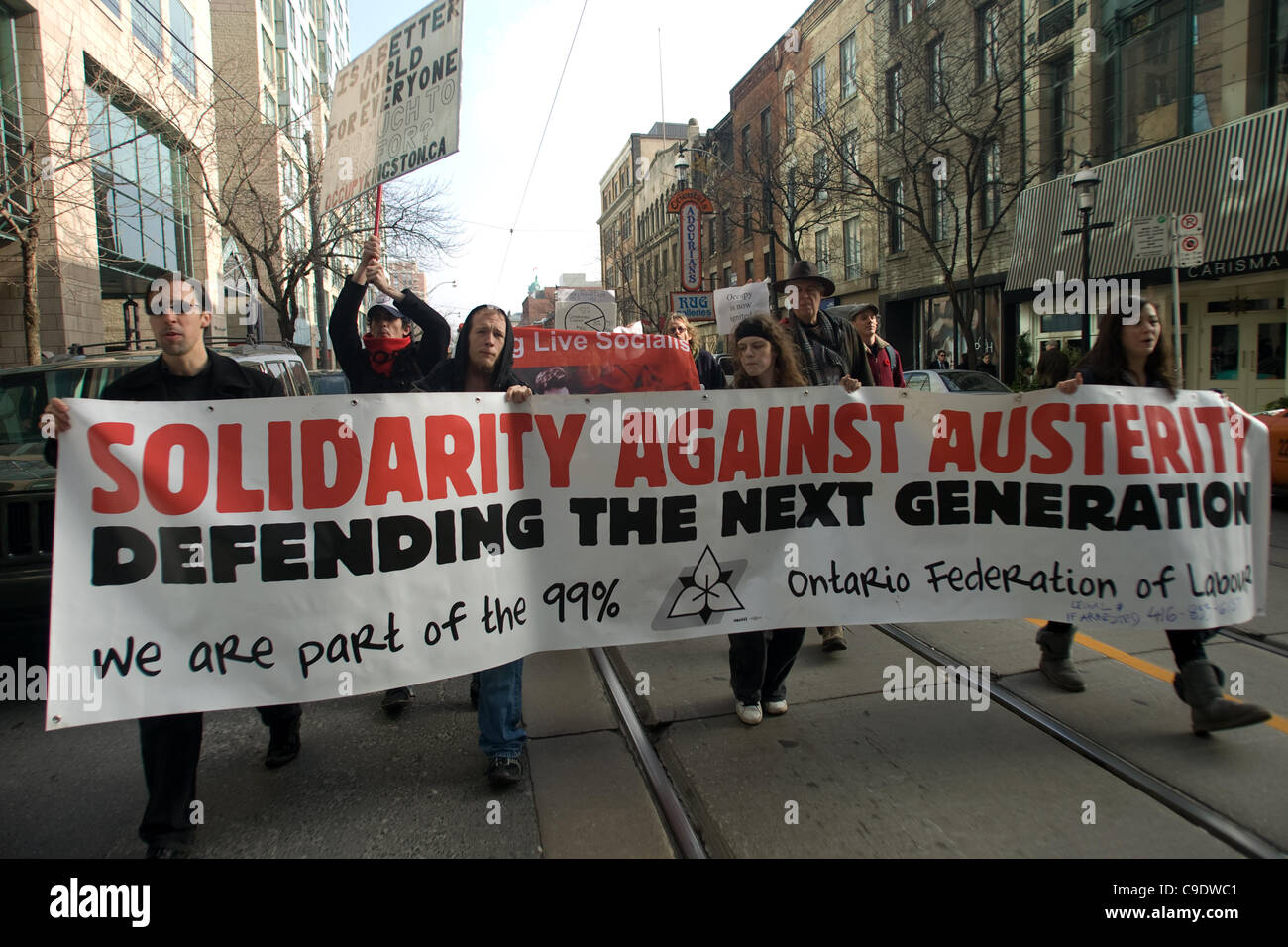 Toronto Ontario, Canada - November 24, 2011. Protestors from Occupy Toronto, London, Kingston and Ottawa join Ontario Federation of Labour members led by Sid Ryan march through the financial district of Toronto. Stock Photo