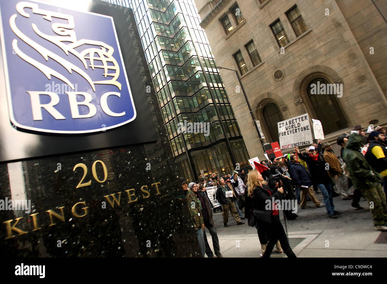 Toronto Ontario, Canada - November 24, 2011. Protestors from Occupy Toronto, London, Kingston and Ottawa join Ontario Federation of Labour members led by Sid Ryan march through the financial district of Toronto. Stock Photo