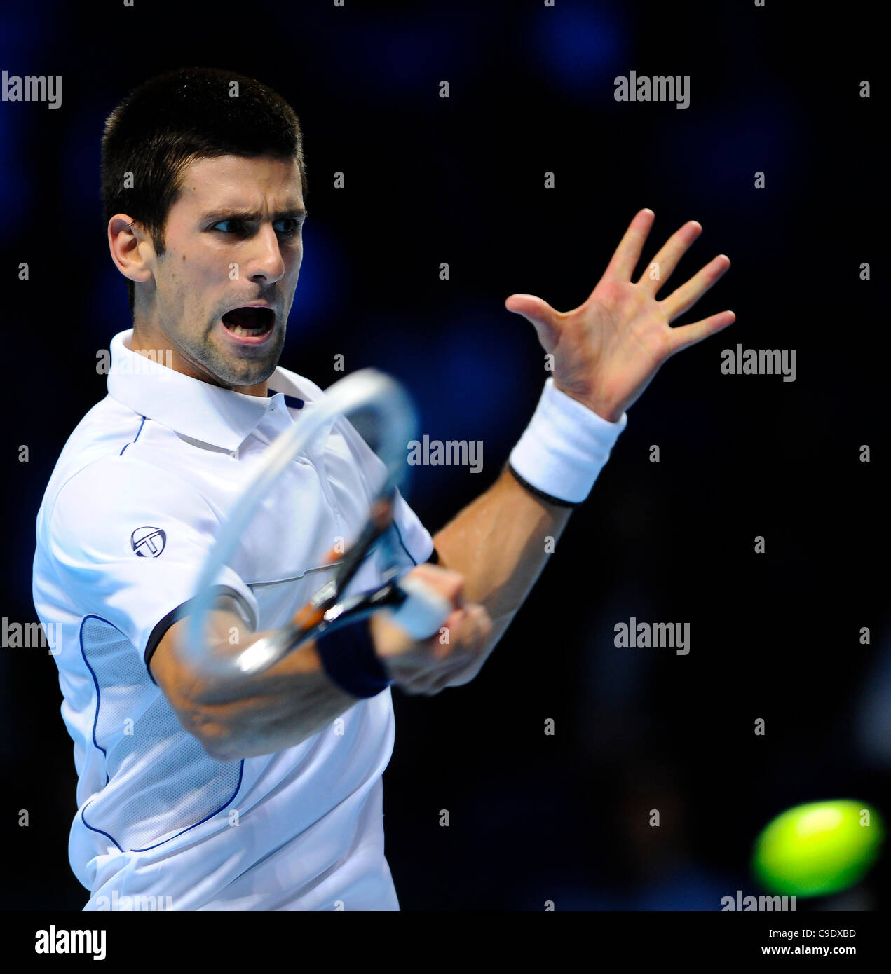 25.11.2011 London, England. [1] Novak Djokovic (SRB) in action against [9] Janko Tipsarevic (SRB) during a round robin match in the Barclays ATP World Tour Finals at The O2 Arena. Tipsarevic went on to beat favourite Djokovic 2 sets to 1. Stock Photo