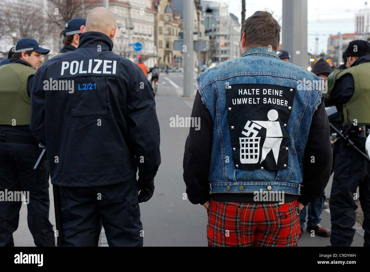 Anti-Fascist participant wearing an anti Nazi illustration in his jacket during a rally against right-wing extremism and Neo Nazi center located in Leipzig Stock Photo