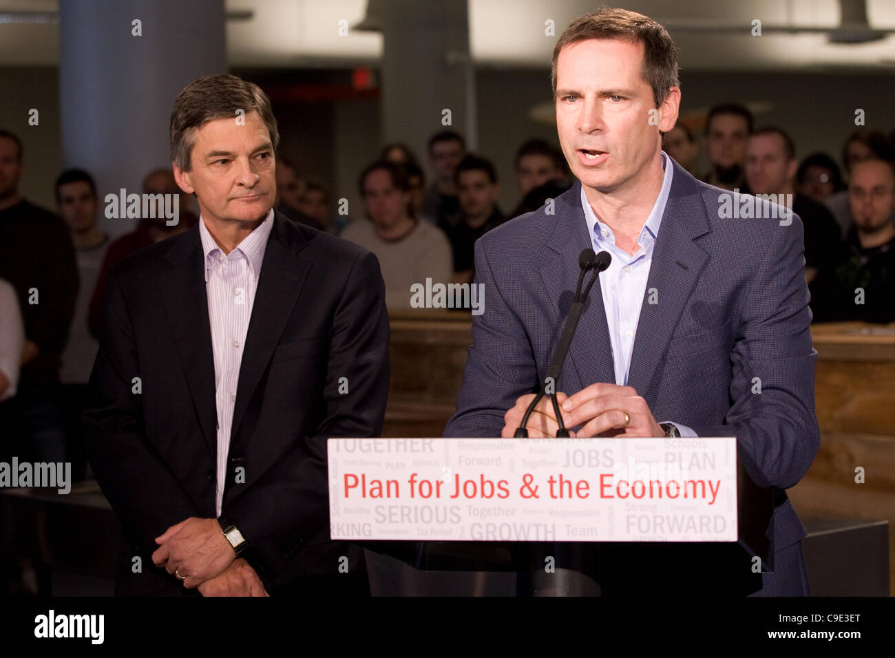 London Ontario, November 28, 2011. Dalton McGuinty, right, Premier of Ontario announces an $80million 'Southwestern Ontario Development Fund along with Chris Bentley, MPP for London West and Minister of the Environment. The funding will be used to create new jobs and protect existing ones.  McGuinty Stock Photo