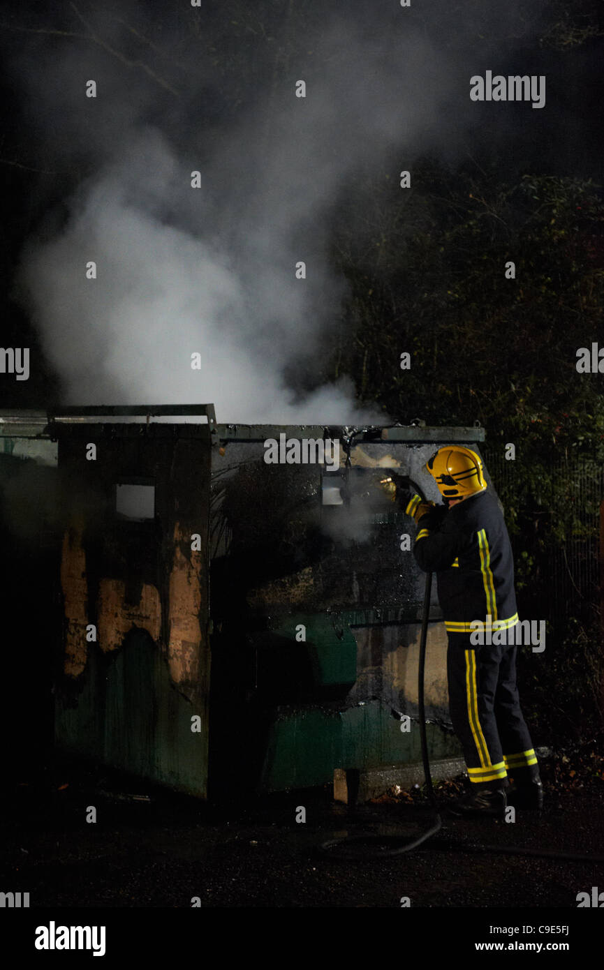 Fire fighters were called to Moor Road, Chesham, Buckinghamshire to put out fire in a recycling bin that was set a blaze by youths.  A passerby spotted 4 youths hanging around the bin and as he approached them the bin burst into flames which is locate just a few feet from the London Metropolitan Tub Stock Photo