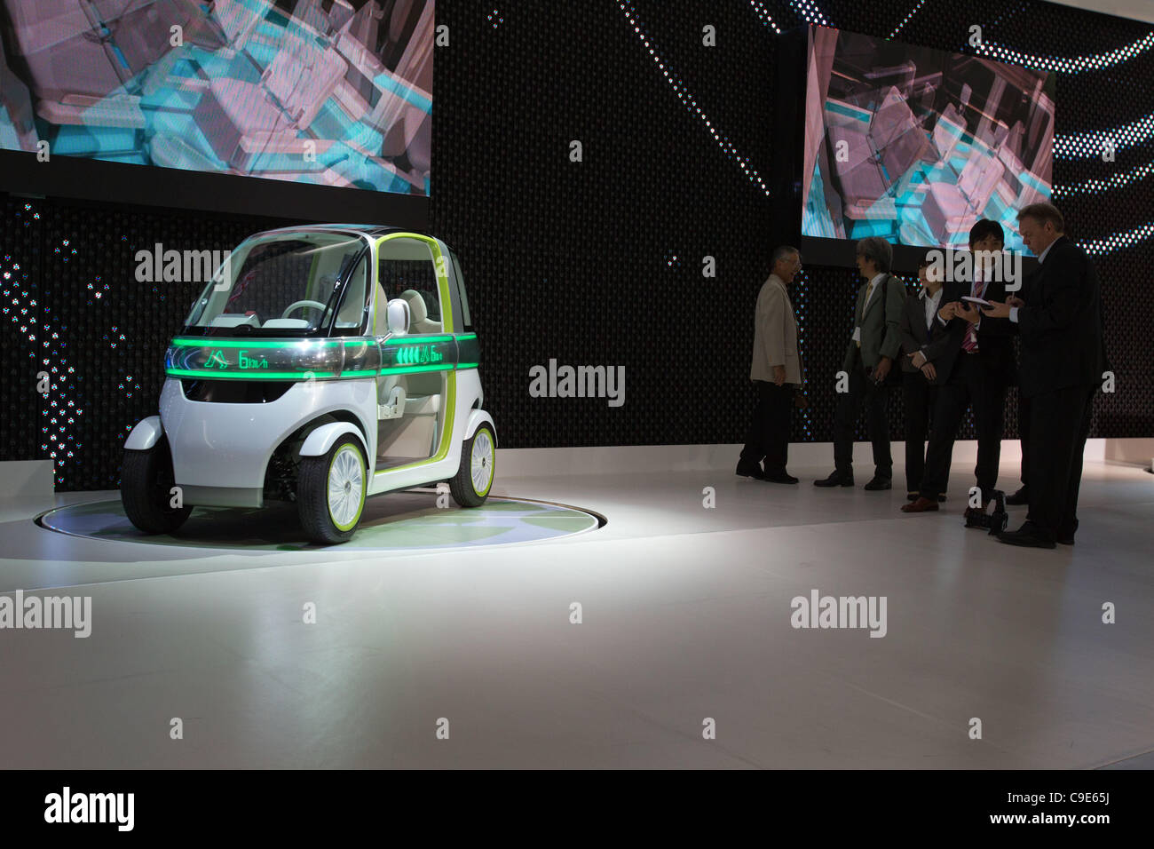 December 30, 2011, Tokyo, Japan -  Journalist speak to Daihatsu Motor Co. employees next to the 'PICO' concept car during the 42nd Tokyo Motor Show. The show opens to the general public from December 3-11. (Photo by Christopher Jue/AFLO) Stock Photo