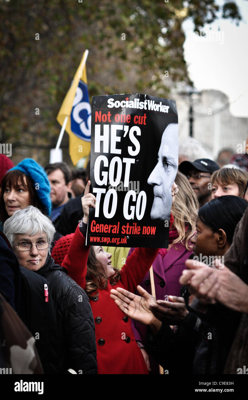 Girl holds placard up at N30 rally on Parliament end of Embankment. Ken Livingstone and other speakers addressed the crowd over public sector pensions. Stock Photo
