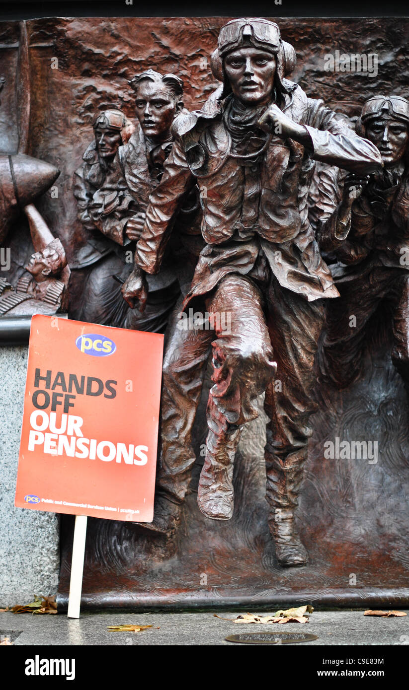 Placard left by protester besides Battle of Britain monument, just behind stage at the N30 rally on the Embankment: 'Hands off our pensions'. The rally has just concluded. Stock Photo