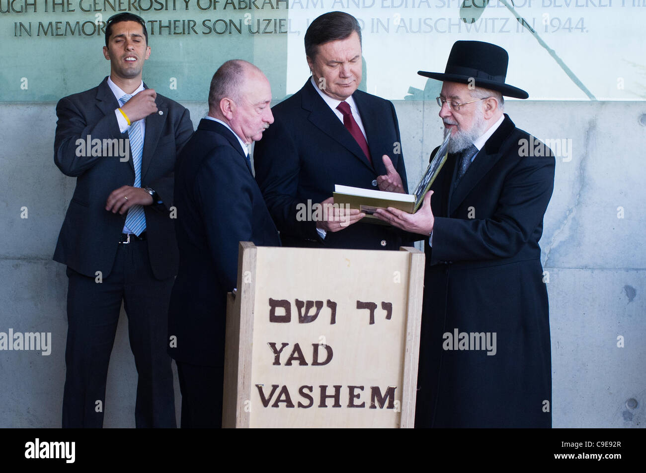 Rabbi Israel Meir Lau, Chairman of Yad Vashem Holocaust Museum, presents President of Ukraine, Viktor Yanukovych, with a gift at the end of the president’s visit in the museum. Jerusalem, Israel. 1st December 2011. Stock Photo