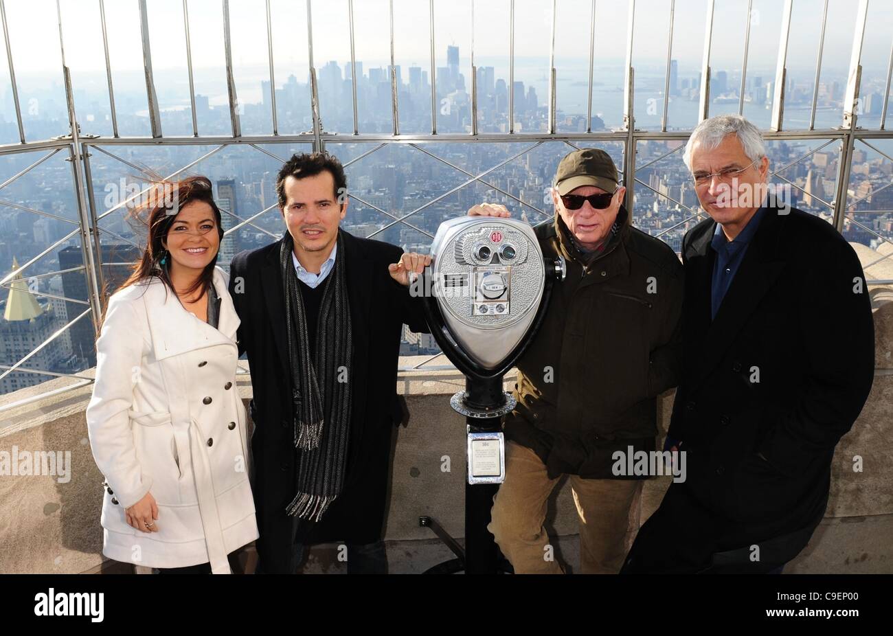 Dec. 9, 2011 - Manhattan, New York, U.S. - From left: LEILANI MUNTER, race car driver and eco-activist, JOHN LEGUIZAMO, RIC O'BARRY, star of ''The Cove'' and LOUIE PSIHOYOS, Director of ''The Cove''.  Actor John Leguizamo and the Academy Award winning team from ''The Cove'' light the Empire State Bu Stock Photo
