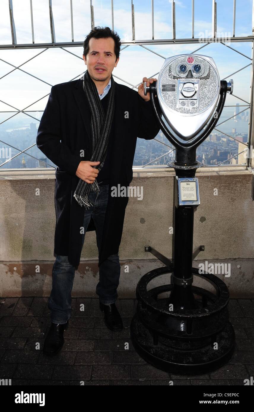 Dec. 9, 2011 - Manhattan, New York, U.S. - Actor JOHN LEGUIZAMO and the Academy Award winning team from ''The Cove'' light the Empire State Building red to raise awareness for the protection of dolphins in Taiji, Japan. (Credit Image: © Bryan Smith/ZUMAPRESS.com) Stock Photo