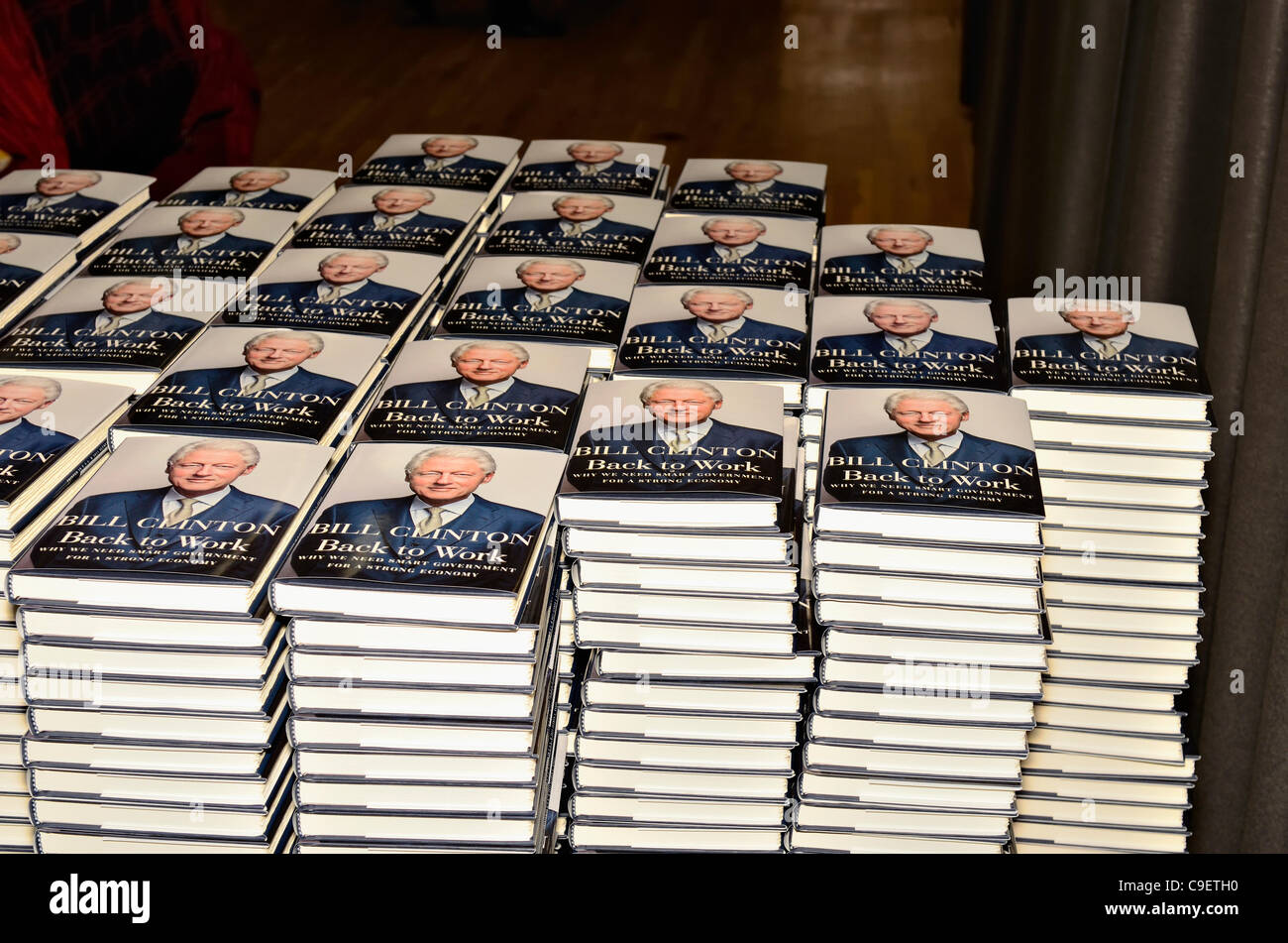 Stacks piles copies of President Bill Clinton's book Back to Work stacked up in rows at his hometown library in Chappaqua New York for book signing. More than 500 people attended the book signing on Friday, December 9, 2011. President Clinton donated 10% of the profits from books sold to the library Stock Photo