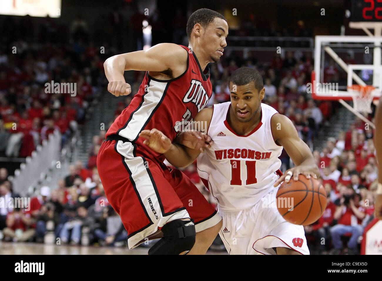 Dec. 10, 2011 - Madison, Wisconsin, U.S - Wisconsin guard Jordan Taylor #11 drives toward the hoop in first half action. At halftime the Wisconsin Badgers lead the UNLV Rebels 36- 23 at the Kohl Center in Madison, Wisconsin. (Credit Image: © John Fisher/Southcreek/ZUMAPRESS.com) Stock Photo