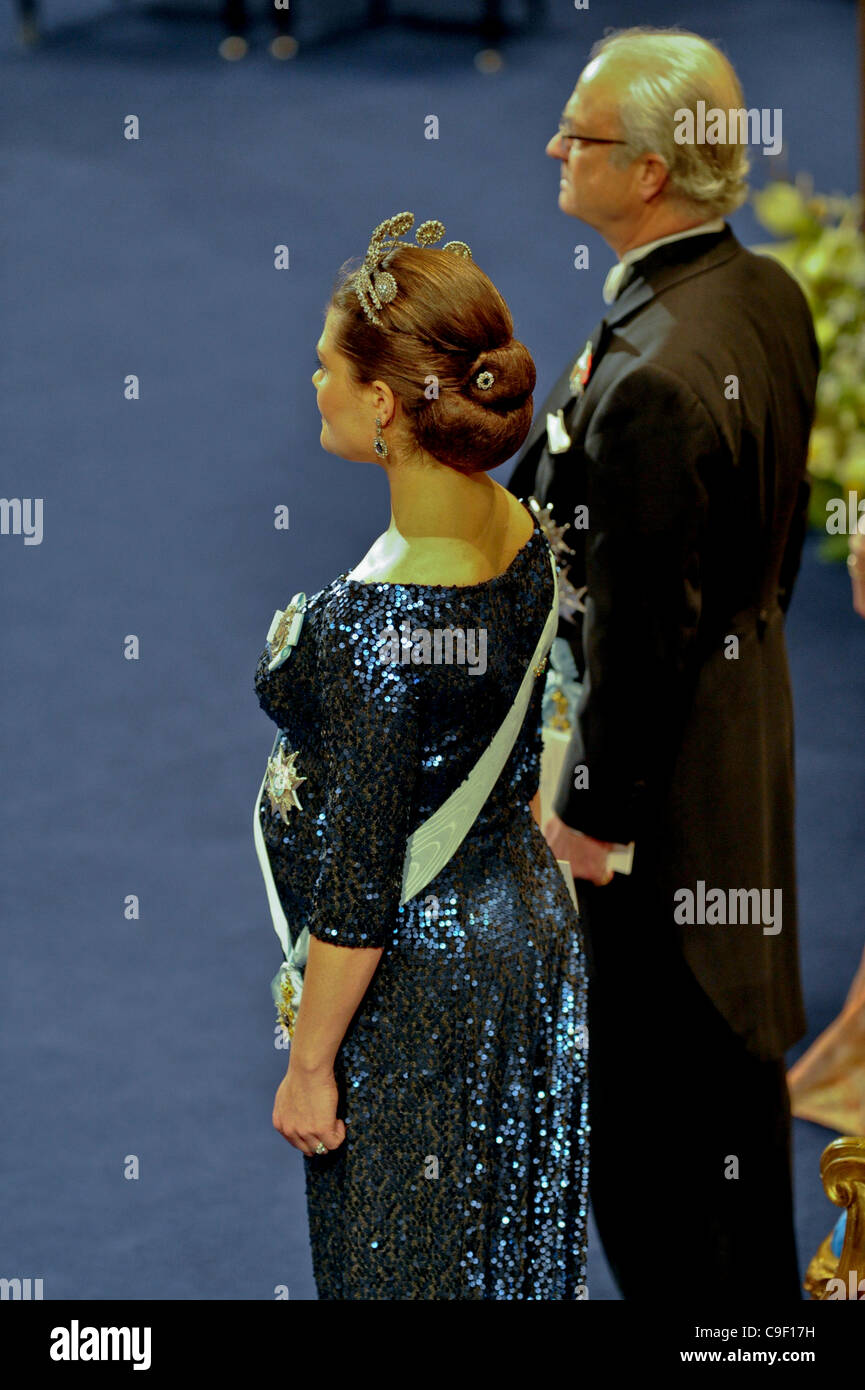 A very pregnant Crown princess Victoria of Sweden attend the Nobel Prize ceremonies in Stockholm on Saturday 10th December 2011. King Carl XVI Gustaf on the right. Stock Photo