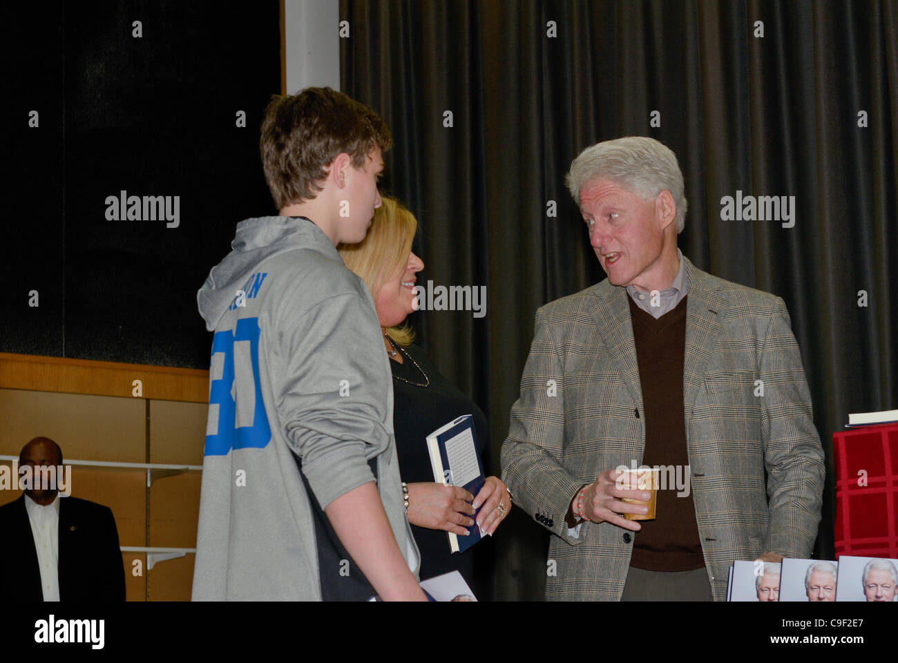 President Bill Clinton signs copies of his new book Back to Work at his hometown library in