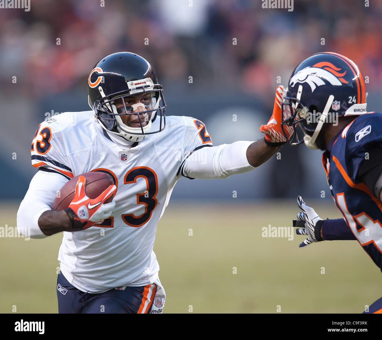 Dec. 11, 2011 - Denver, Colorado, U.S - Chicago Bears DEVIN HESTER, left, returns a punt for yardage against Denver Broncos CB CHAMP BAILEY, right, during the 3rd. quarter at Sports Authority Field at Mile High Sunday afternoon. The Broncos beat the Bears in OT 13-10. (Credit Image: © Hector Acevedo Stock Photo