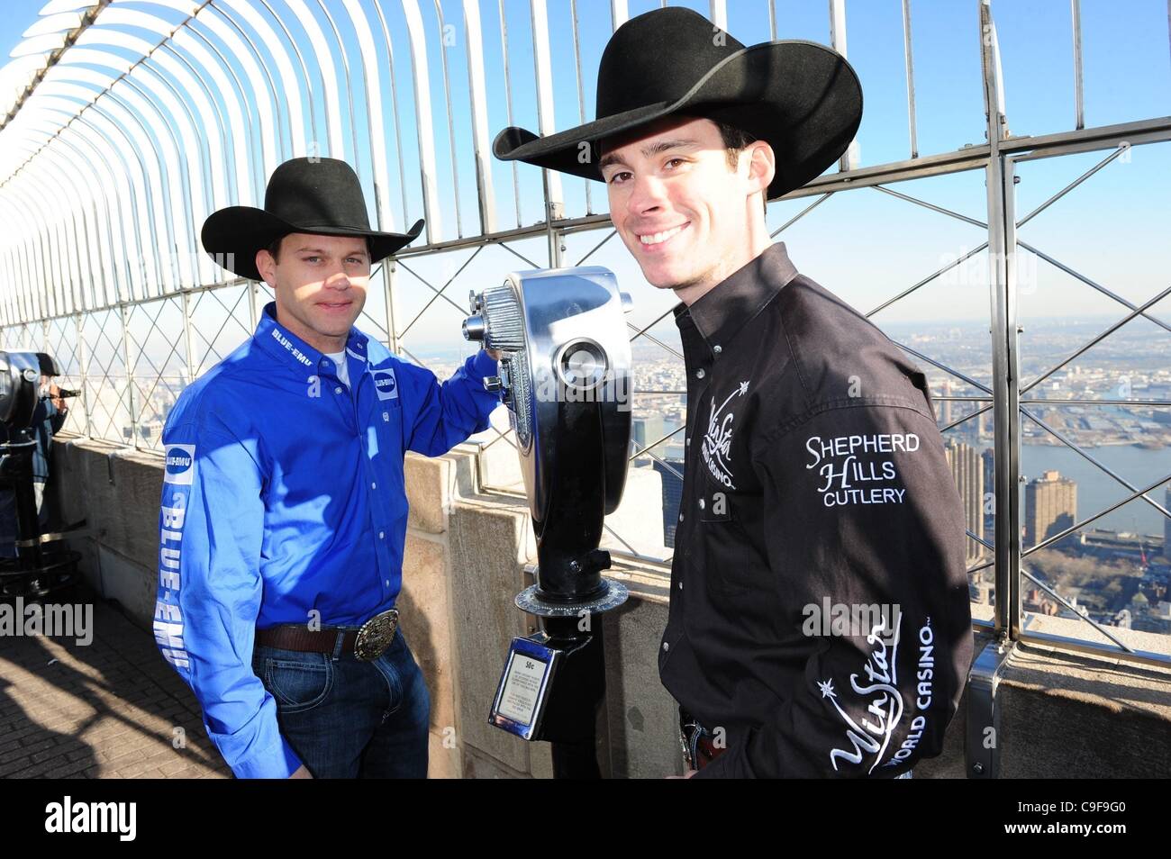 Dec. 13, 2011 - Manhattan, New York, U.S. - Real-life cowboys from Professional Bull Riders (PBR), LUKE SNYDER and COLBY YATES tour the 86th floor Observatory of the Empire State Building ahead of next month's 6th Annual Madison Square Garden Invitational of Professional Bull Riders. (Credit Image:  Stock Photo