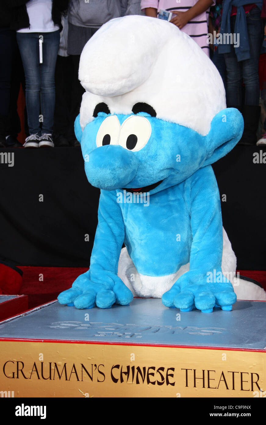 CLUMSY THE SMURFS HONORED WITH HAND AND FOOTPRINTS HOLLYWOOD LOS ANGELES CALIFORNIA USA 13 December 2011 Stock Photo