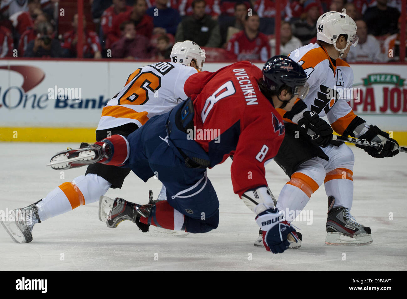 Dec. 13, 2011 - Washington Dc, District of Columbia, United States of America - NHL; Washington Capitals left wing Alex Ovechkin (8) tripped up by Philadelphia Flyers center Zac Rinaldo (36) and loosing balance.  Flyers continue their wining streak defeating the Capitals at home 5 - 1 (Credit Image: Stock Photo