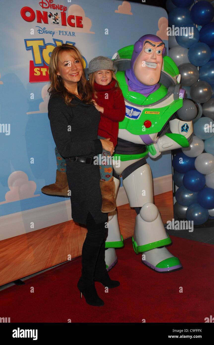 Megyn Price, daughter Grace at arrivals for Disney On Ice Presents Disney Pixar's Toy Story 3 Premiere, LA Kings Holiday Ice at L.A. LIVE at Nokia Plaza, Los Angeles, CA December 14, 2011. Photo By: Elizabeth Goodenough/Everett Collection Stock Photo