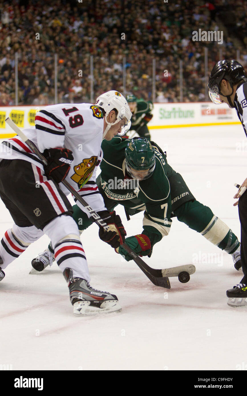 Dec. 14, 2011 - St. Paul, Minnesota, U.S - Minnesota Wild center Matt Cullen (7) and Chicago Blackhawks center Jonathan Toews (19) face off in the second period of the hockey game at the Xcel Energy Center in St. Paul, Minnesota. The score was tied 2-2 after two periods and the Blackhawks went on to Stock Photo