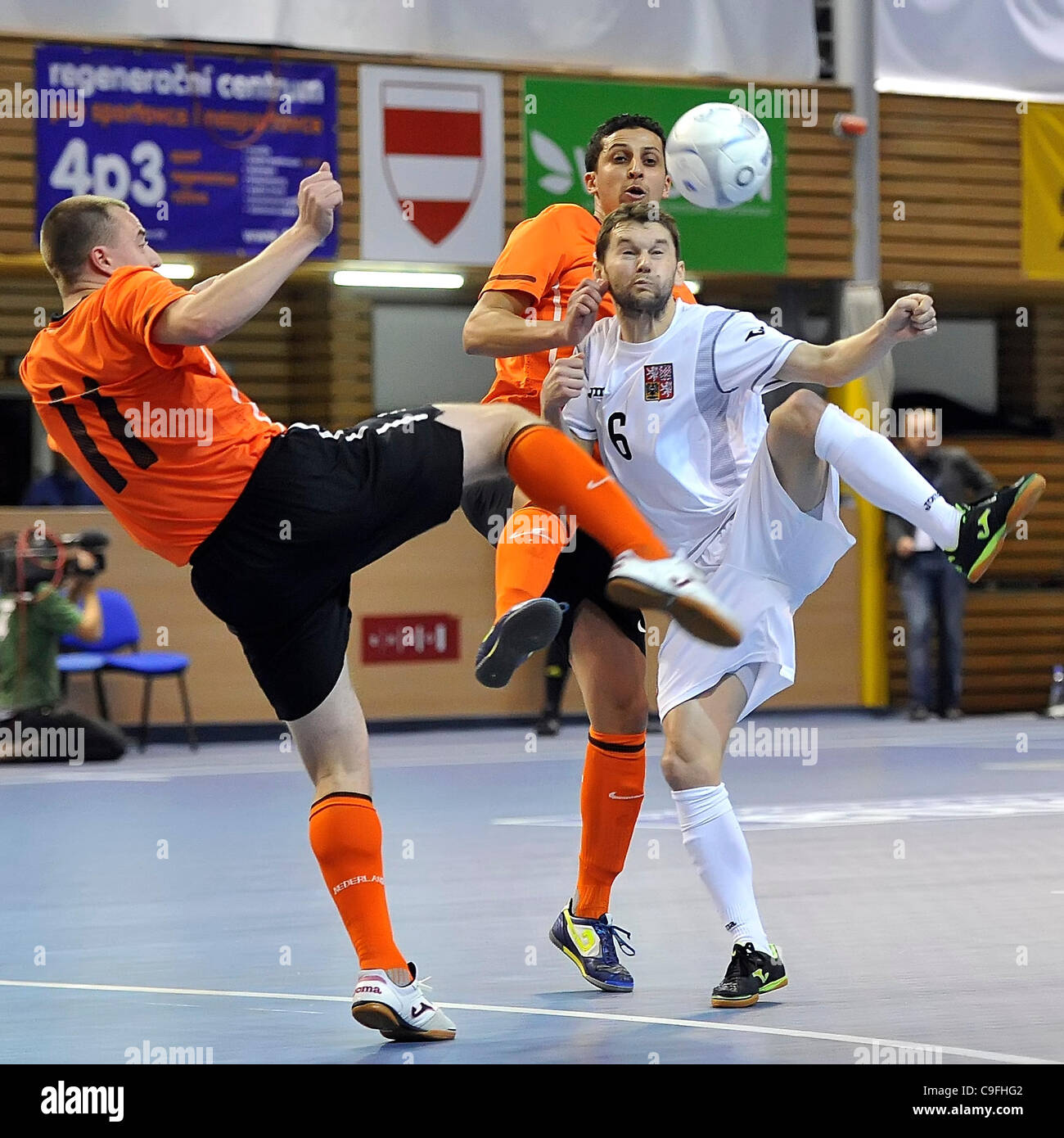 Netherlands Dick Hulshorst (left to right) and Omar Nejjari and Czech Roman Mares during the World Futsal Championships qualification match Czech Republic vs Netherlands in Brno, Czech Republic, on Thursday, December 15, 2011. (CTK Photo/Igor Sefr) Stock Photo