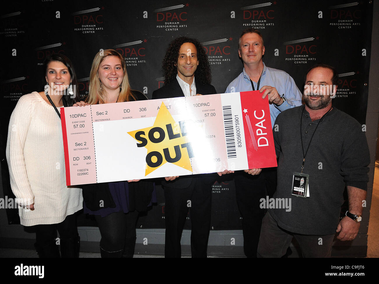 Dec. 15, 2011 - Durham, North Carolina; USA - Musician KENNY G takes a moment with (L-R) DPAC'S RACHEL GRAGG, JENNIE LANNING, KENNY G, General Manager BOB KLAUS and AEG'S SCOTT GARTNER before he performs live as his 2011 tour makes a stop to a sold out audience at the Durham Performing Arts Center.  Stock Photo