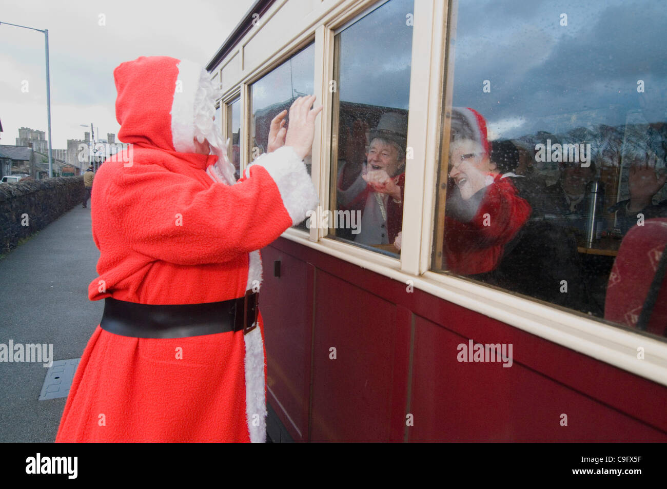 Santa and his elves entertain and give out presents to children aboard