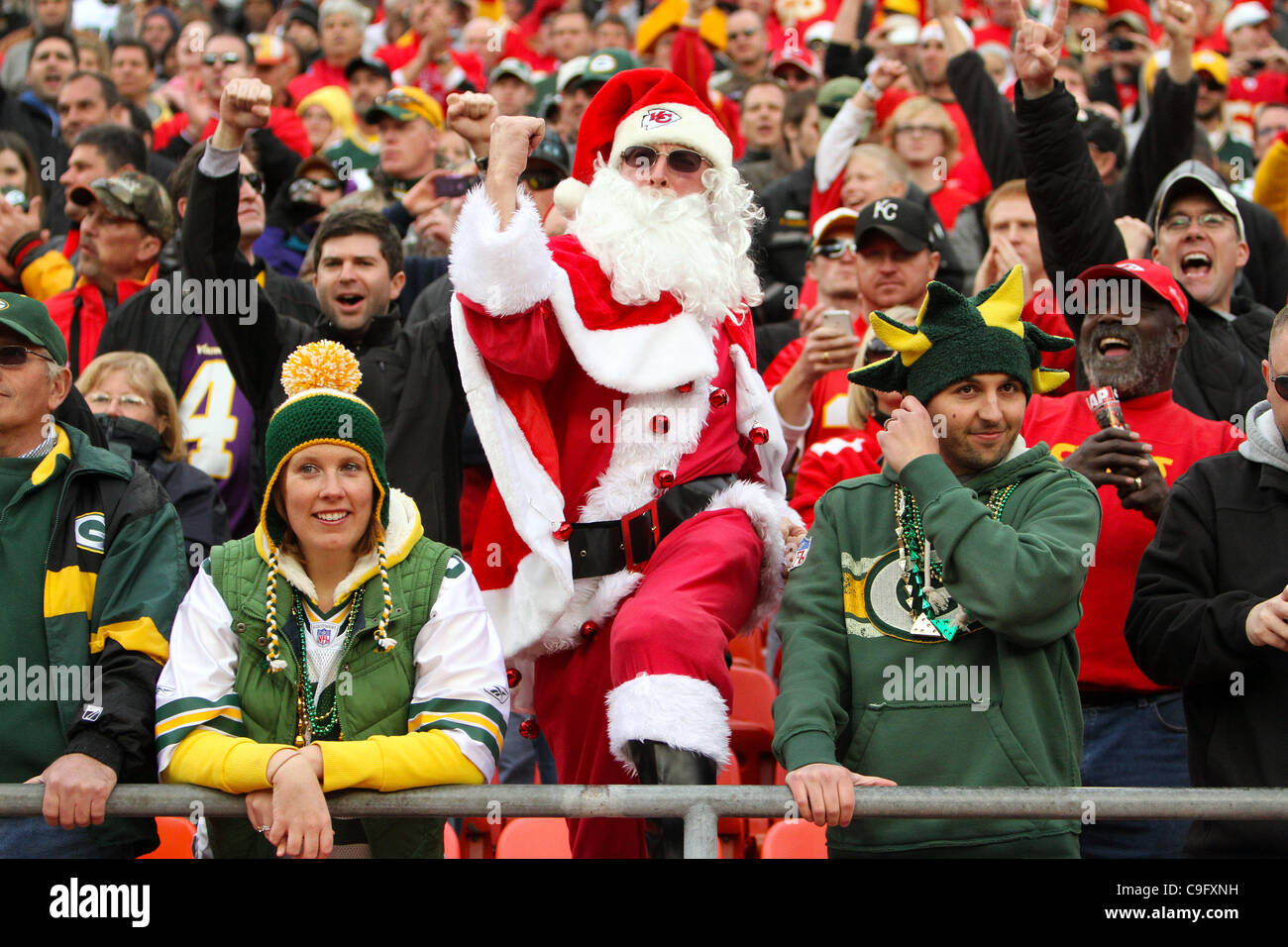 Dec. 18, 2011 - Kansas City, Missouri, United States of America - A Kansas City Chiefs fan dressed as Santa Clause celebrates the Chiefs' victory between two dejected Green Bay Packers fans. The Kansas City Chiefs defeat the Green Bay Packers 19-14 in the game at Arrowhead Stadium. (Credit Image: ©  Stock Photo