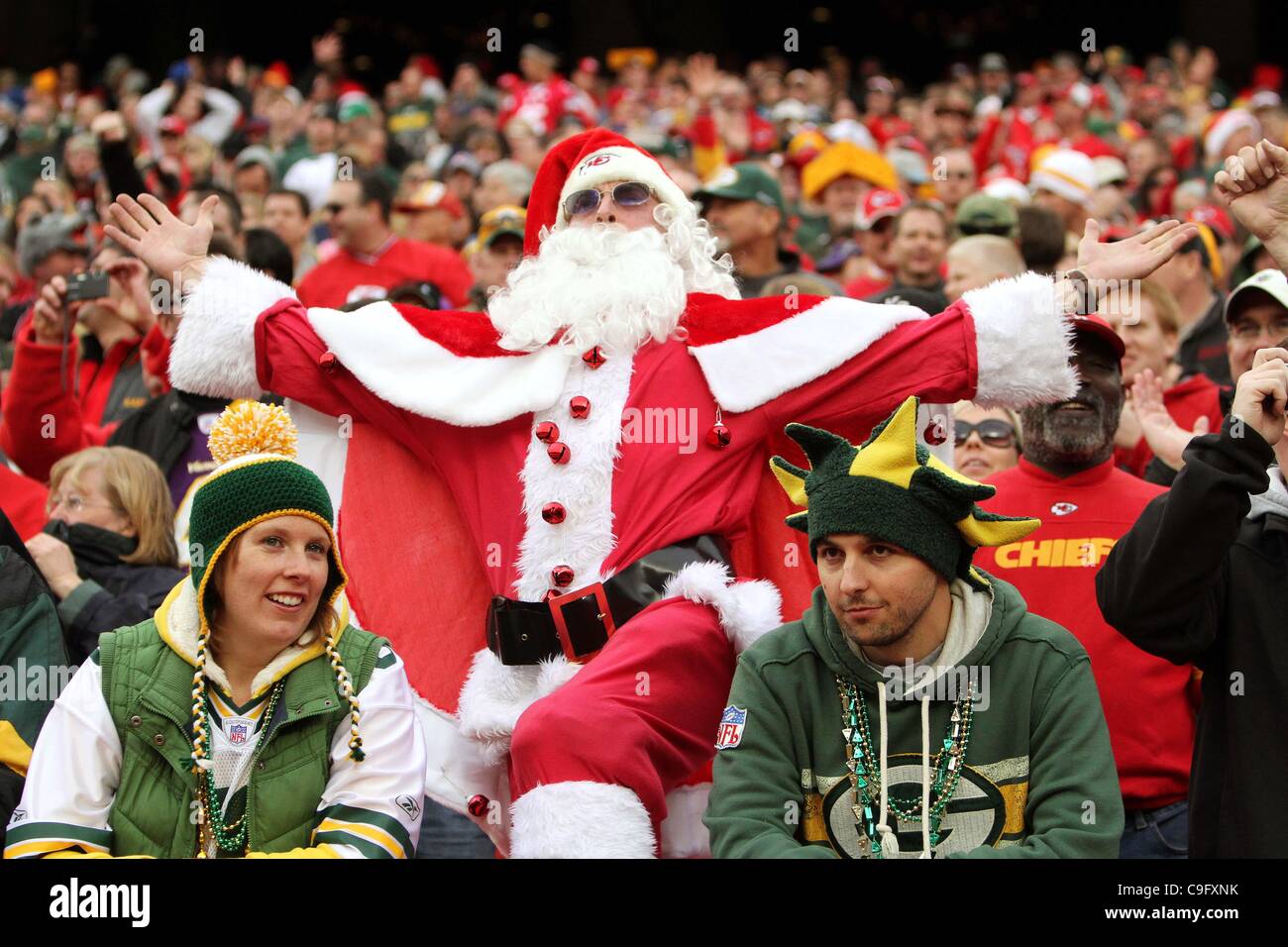 Dec. 18, 2011 - Kansas City, Missouri, United States of America - A Kansas City Chiefs fan dressed as Santa Clause celebrates the Chiefs' victory between two dejected Green Bay Packers fans. The Kansas City Chiefs defeat the Green Bay Packers 19-14 in the game at Arrowhead Stadium. (Credit Image: ©  Stock Photo