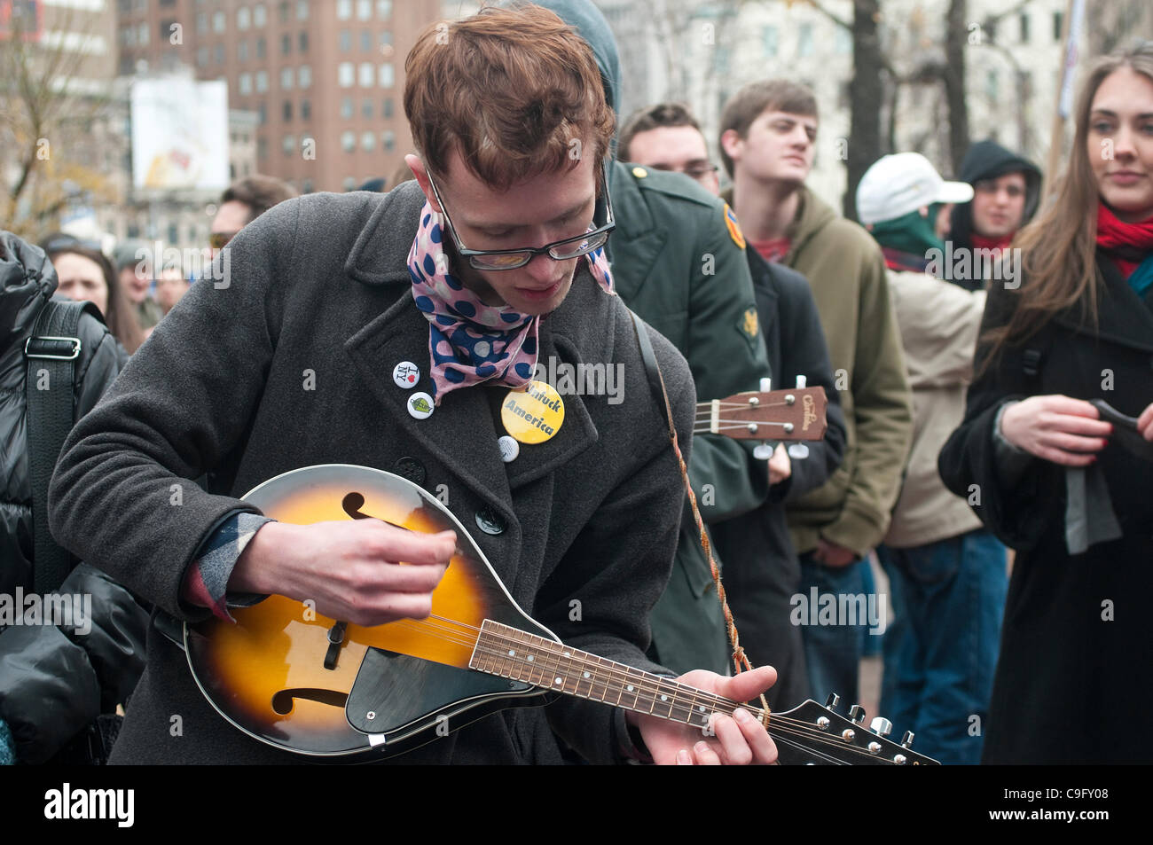 New York, NY - December 17 - Occupy Wall street protesters launched Occupy 2. 0, marking their three month anniversary with Music, dance and street theatre in Duarte Square. 50 people were arrested when they scaled a fence attempting to occupy a vacant lot owned by Trinity Church. Stock Photo