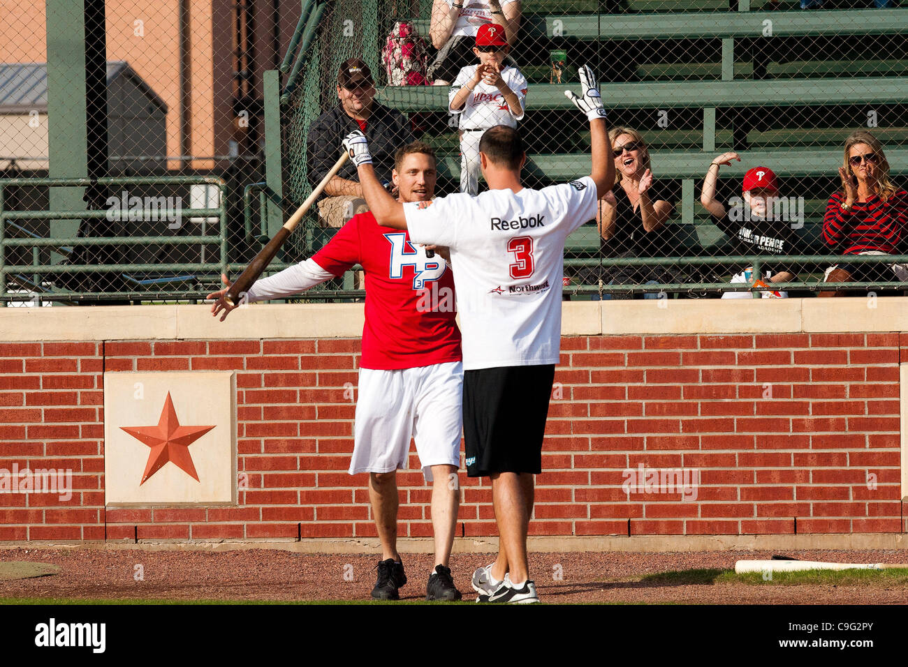 Dec. 18, 2011 - Houston, Texas, U.S - MLB Player Seth Overby P celebrates with Hunter Pence after hitting two home-runs in the home-run derby during the 3rd Annual Hunter Pence Baseball Camp at Baseball USA in Houston, TX. (Credit Image: © Juan DeLeon/Southcreek/ZUMAPRESS.com) Stock Photo