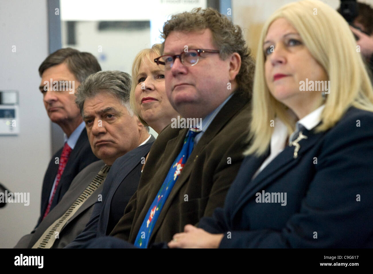 London Ontario, Canada - December 20, 2011. From left to right Chris Bentley, MPP - Minister of the Environment, Joe Fontana, Mayor of London Ontario, Deb Matthews, MPP - Minister of Health and Long Term Care, Ed Holder, MP - London West and Susan Truppe MP - London North Centre listen to a presenta Stock Photo