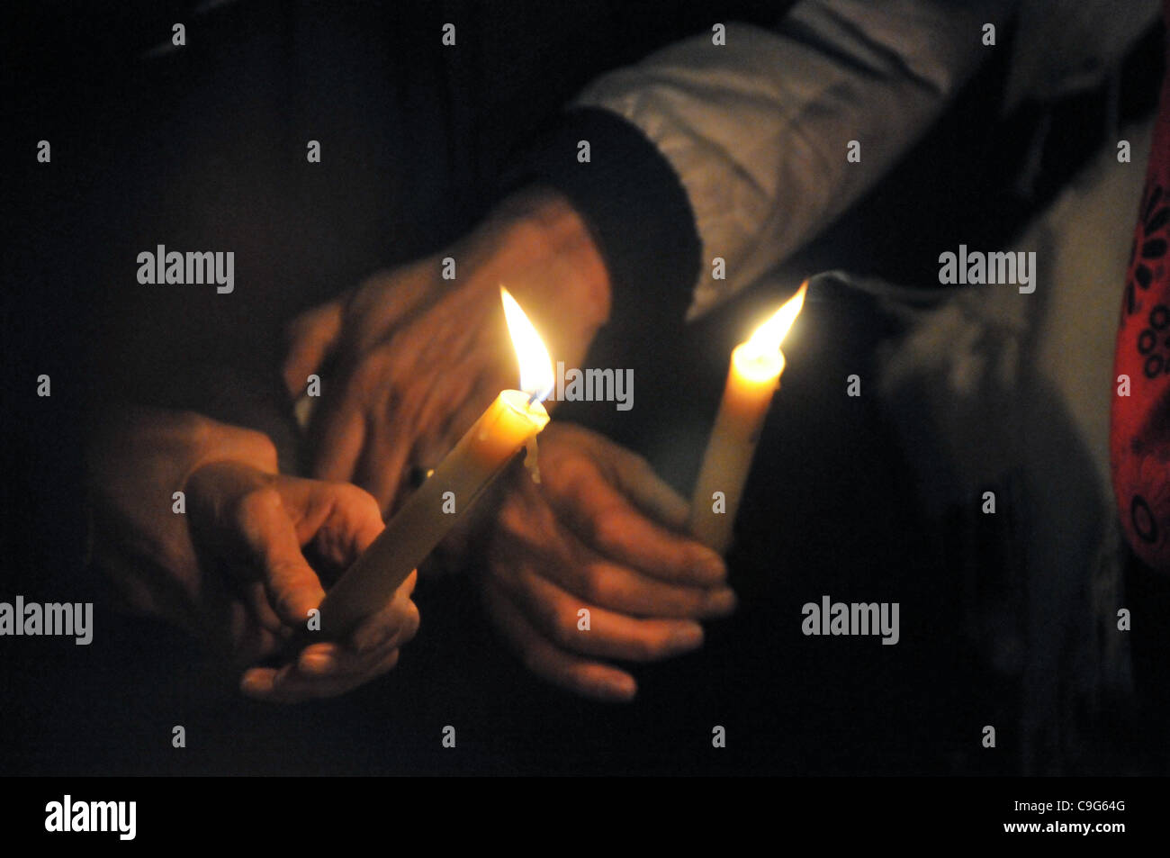 Holding candles at a Vigil for Cyclists killed on the roads in London