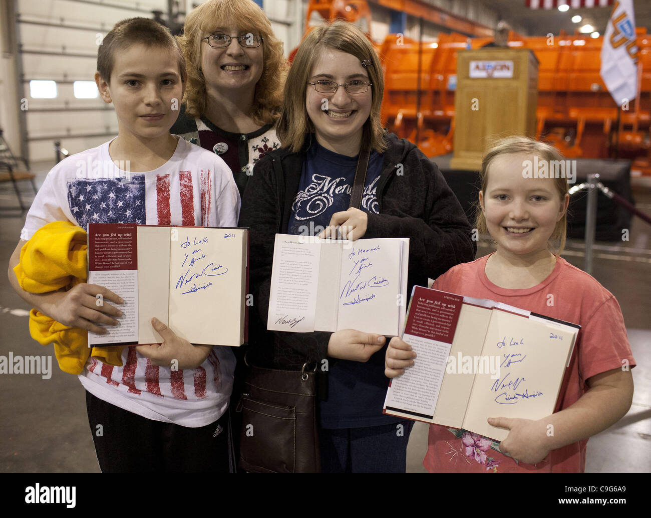 Dec. 20, 2011 - Ottumwa, IA, USA - Constance Cavanaugh (2nd L), with her (home-schooled) children Luke (14yo), Hanah (15yo) and Lea (8yo), pose with books signed by former House Speaker Newt Gingrich who spoke to employees of the AlJon Company in Ottumwa, Iowa. (Credit Image: © James Colburn/ZUMAPRE Stock Photo
