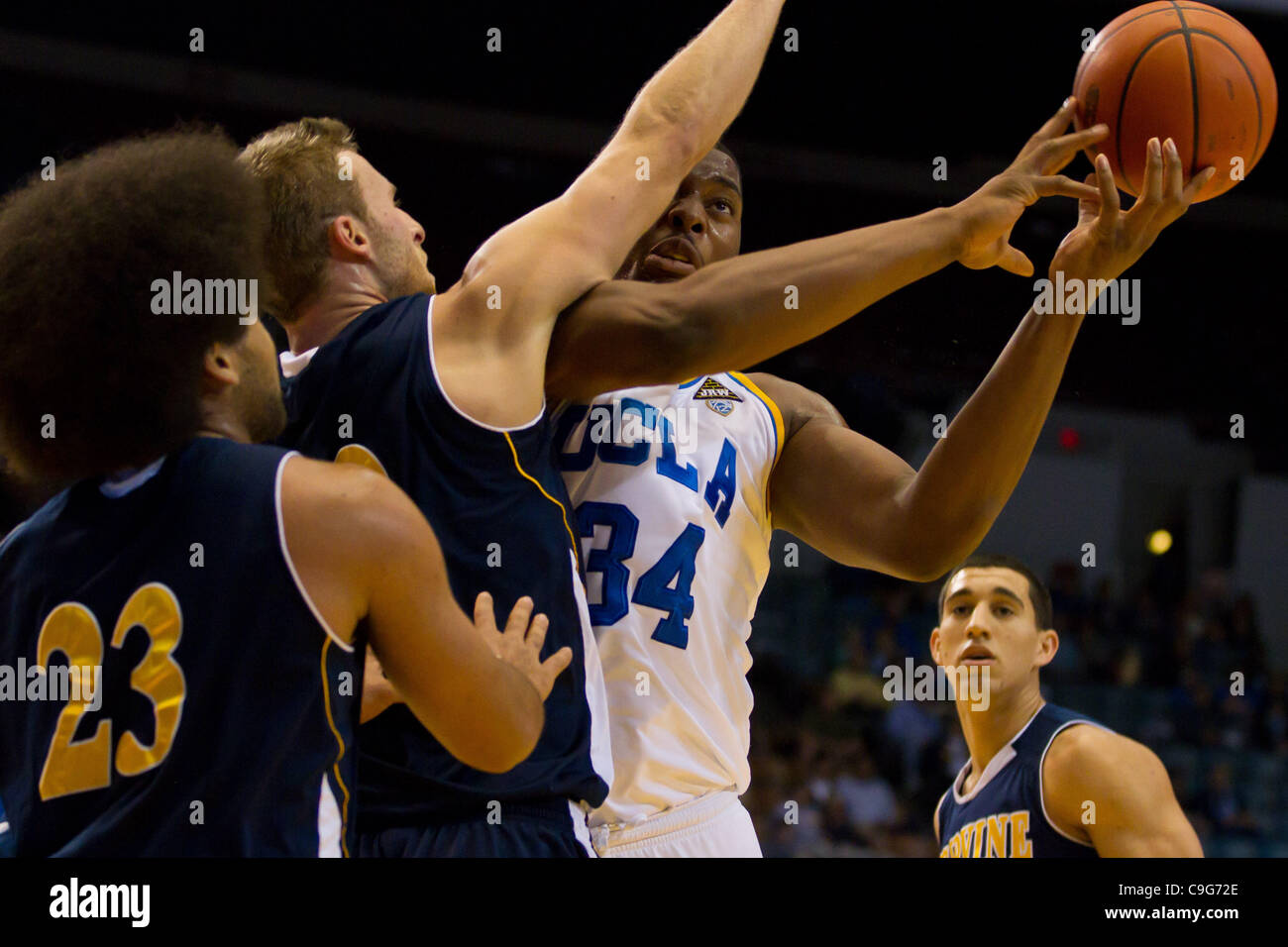 Dec. 20, 2011 - Los Angeles, California, U.S - UCLA Bruins Joshua Smith (34) gets fouled while driving to the basket in first half action.  The UCLA Bruins defeat the UC Irvine Anteaters 89-60. (Credit Image: © Josh Chapel/Southcreek/ZUMAPRESS.com) Stock Photo