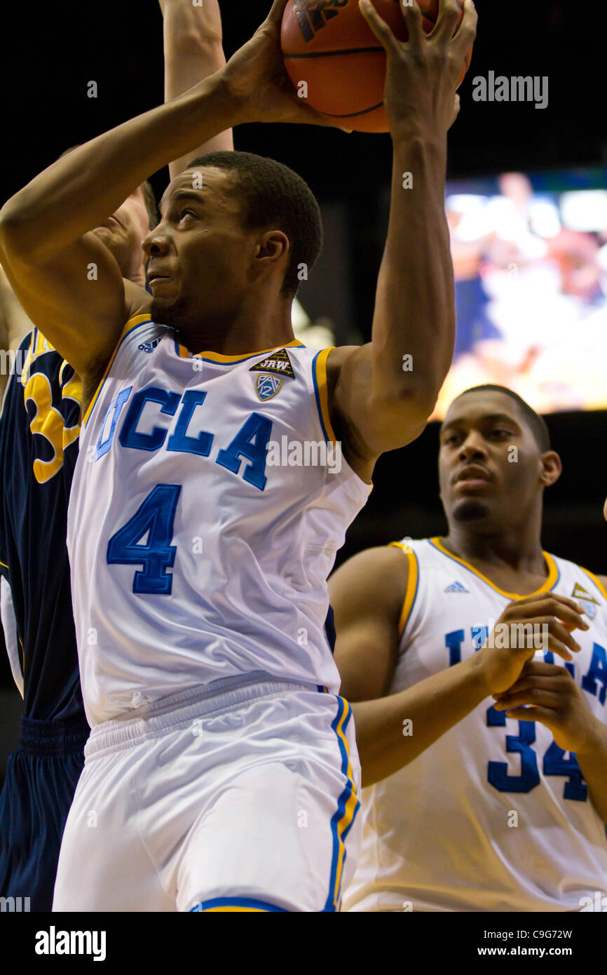 Dec. 20, 2011 - Los Angeles, California, U.S - UCLA Bruins Norman Powell (4) drives to the basket as Joshua Smith (34) observes from behind.  The UCLA Bruins defeat the UC Irvine Anteaters 89-60. (Credit Image: © Josh Chapel/Southcreek/ZUMAPRESS.com) Stock Photo