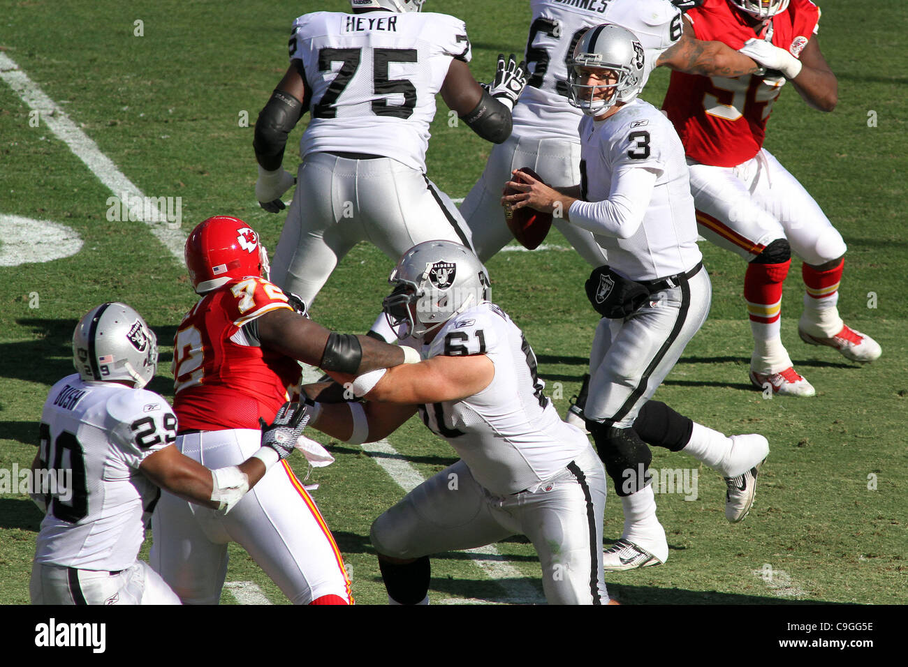 Dec. 24, 2011 - Kansas City, Missouri, United States of America - Oakland Raiders quarterback Carson Palmer (3) looks to pass to running back Michael Bush (29) during first half action. The Chiefs are tied with the Raiders 3-3 in the game at Arrowhead Stadium. (Credit Image: © Jacob Paulsen/Southcre Stock Photo