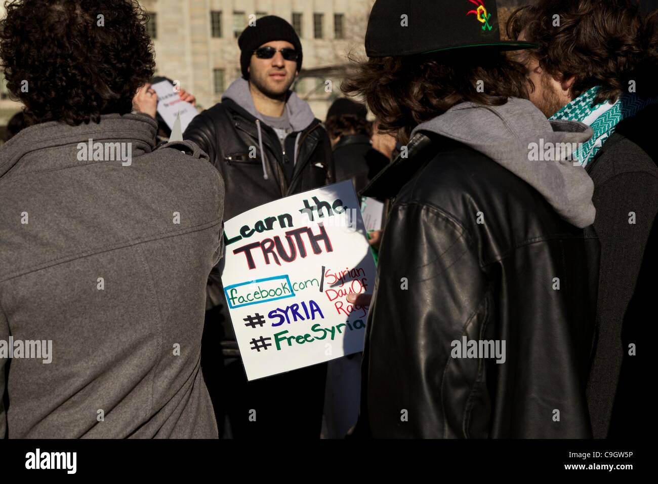 Chicago, USA, 29/12/2011. Protesters in Pioneer Court during anti-Syrian government protest.  The demonstrators gathered to protest the Syrian government's treatment of its citizens. Stock Photo