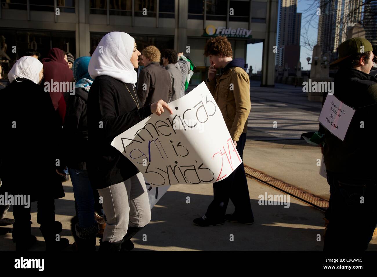 Chicago, USA, 29/12/2011. Protesters in Pioneer Court during anti-Syrian government protest. . The demonstrators gathered to protest the Syrian government's treatment of its citizens. Stock Photo