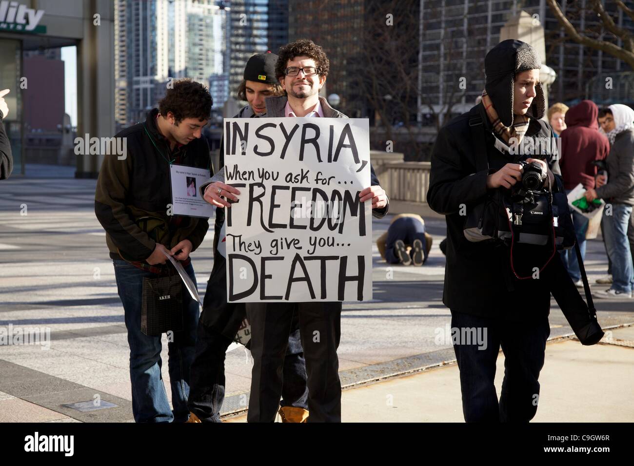 Chicago, USA, 29/12/2011. Protesters in Pioneer Court during anti-Syrian government protest. The demonstrators gathered to protest the Syrian government's treatment of its citizens. Stock Photo